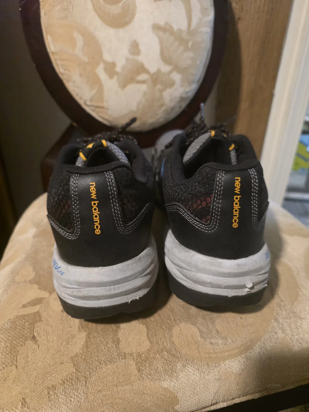 New Balance Gray and Black Men's Athletic Sneakers with Blue Accents